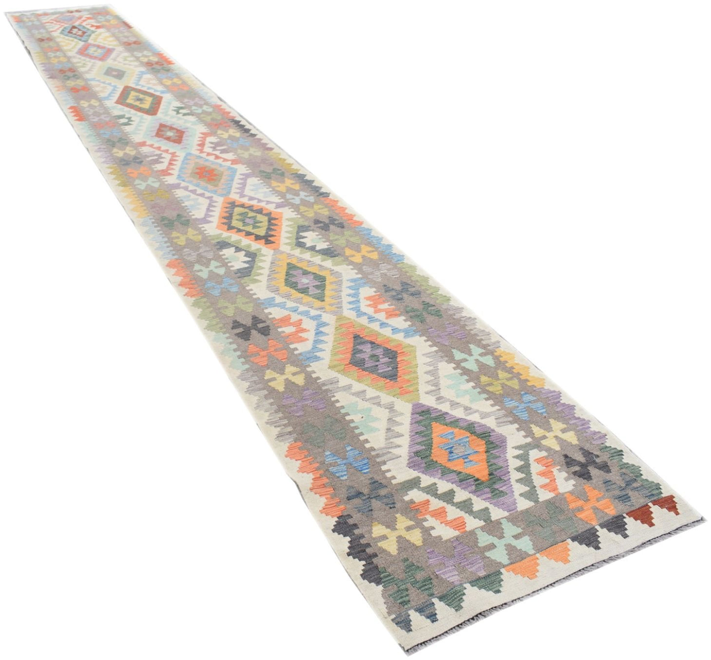 A handmade Afghan Maimana wool runner rug featuring a colorful geometric diamond pattern.