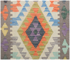 Handmade Afghan Maimana kilim runner featuring a geometric diamond pattern in vibrant colors.