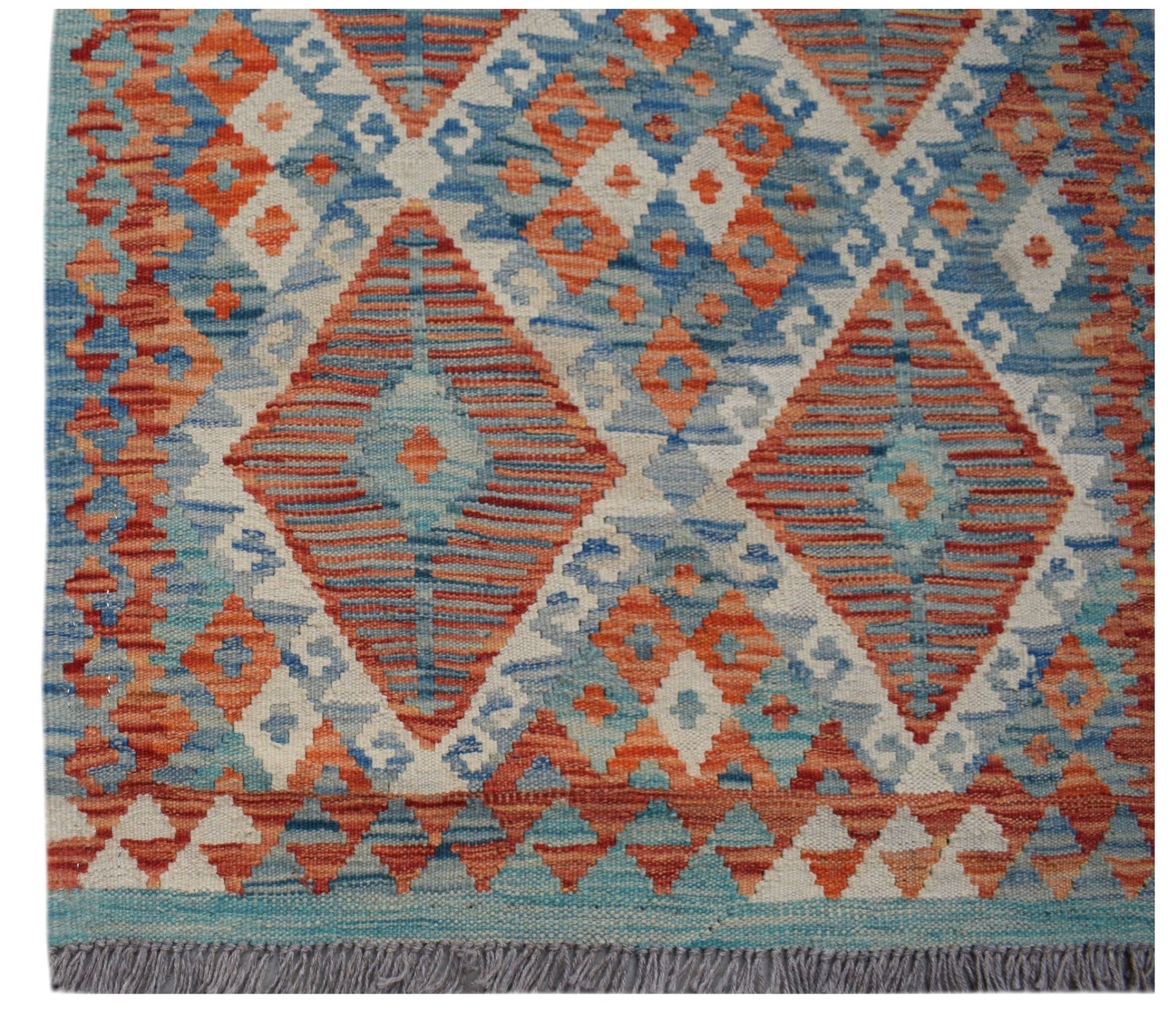 Handwoven Afghan Maimana kilim runner featuring a geometric diamond pattern in blue and orange.