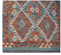 Handwoven Afghan Maimana kilim runner featuring a geometric diamond pattern in blue and orange.