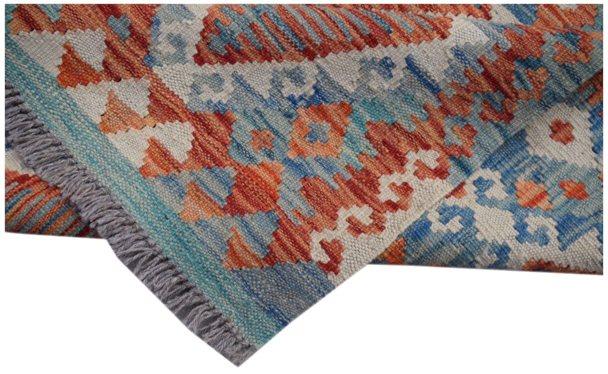 Handwoven Afghan Maimana kilim runner featuring a geometric pattern in orange, blue, and cream.
