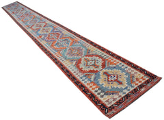 A long, handwoven Afghan Maimana wool runner featuring a colorful geometric pattern.