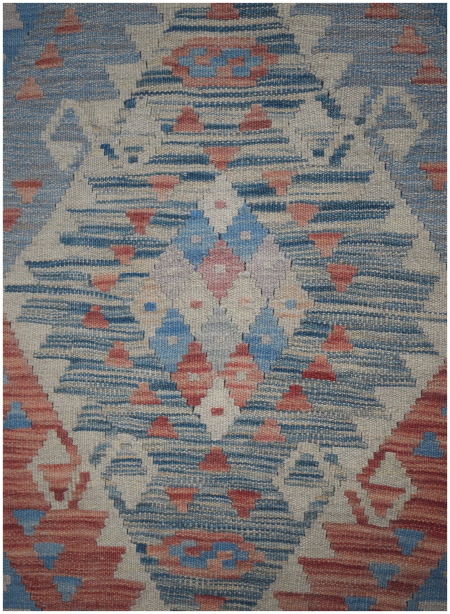 Handmade Afghan Maimana kilim runner featuring a geometric pattern in blue, cream, and terracotta.