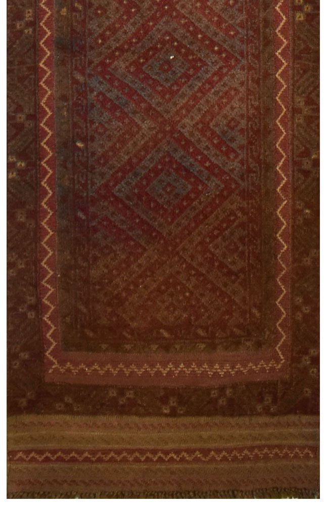 Handmade Afghan Mashwani runner featuring intricate geometric patterns in deep red and brown wool.