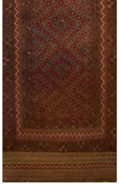Handmade Afghan Mashwani runner featuring intricate geometric patterns in deep red and brown wool.