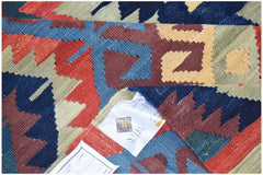 Afghan Mazari Sharif Kilim with geometric patterns in red, blue, and tan.