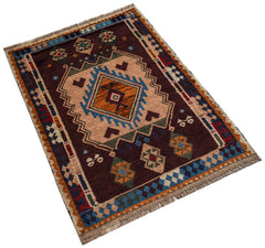 Handmade Afghan Pashm rug featuring a geometric tribal pattern in shades of brown, blue, and orange.