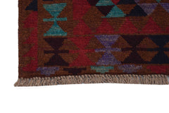 Handmade Afghan Pashm rug featuring a geometric tribal pattern in shades of brown, red, and blue.