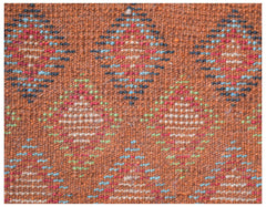 Handmade Afghan Pashm rug featuring a repeating diamond pattern in red, blue, and ivory on brown.