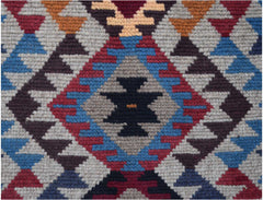 Handmade Afghan Pashm rug featuring a geometric tribal pattern in red, blue, brown, and ivory.