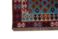 A handmade Afghan Pashm rug featuring a geometric pattern in red, blue, brown, and ivory tones.