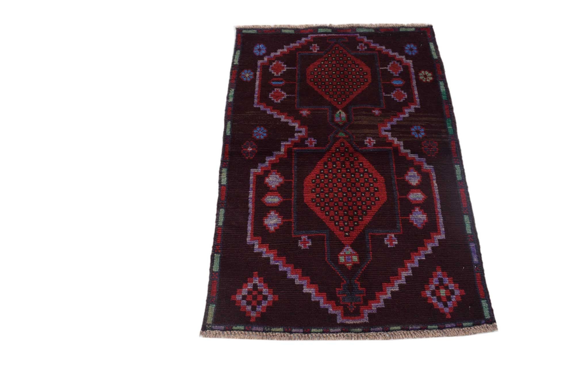 Handmade Afghan Pashm rug featuring a dark brown field with geometric red diamond motifs.