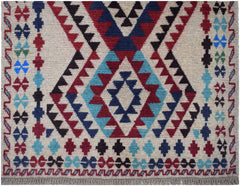 Handmade Afghan Pashm rug featuring a geometric tribal pattern in red, blue, and ivory wool.