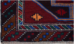 A handmade Afghan Pashm rug featuring geometric tribal patterns in deep red, blue, and brown tones.
