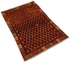 A handmade Afghan Pashm rug featuring a repeating diamond pattern in dark red and brown tones.