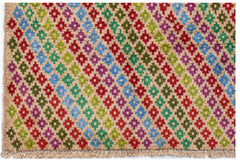 Handmade Afghan Pashm rug featuring a colorful geometric diamond pattern on a tan wool background.