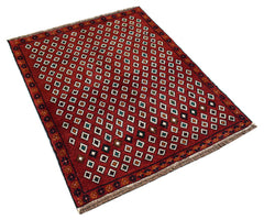 A handmade Afghan Pashm rug featuring a repeating pattern of small white squares on a red field.