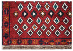 Handmade Afghan Pashm rug featuring a geometric diamond pattern in red, blue, and ivory wool.