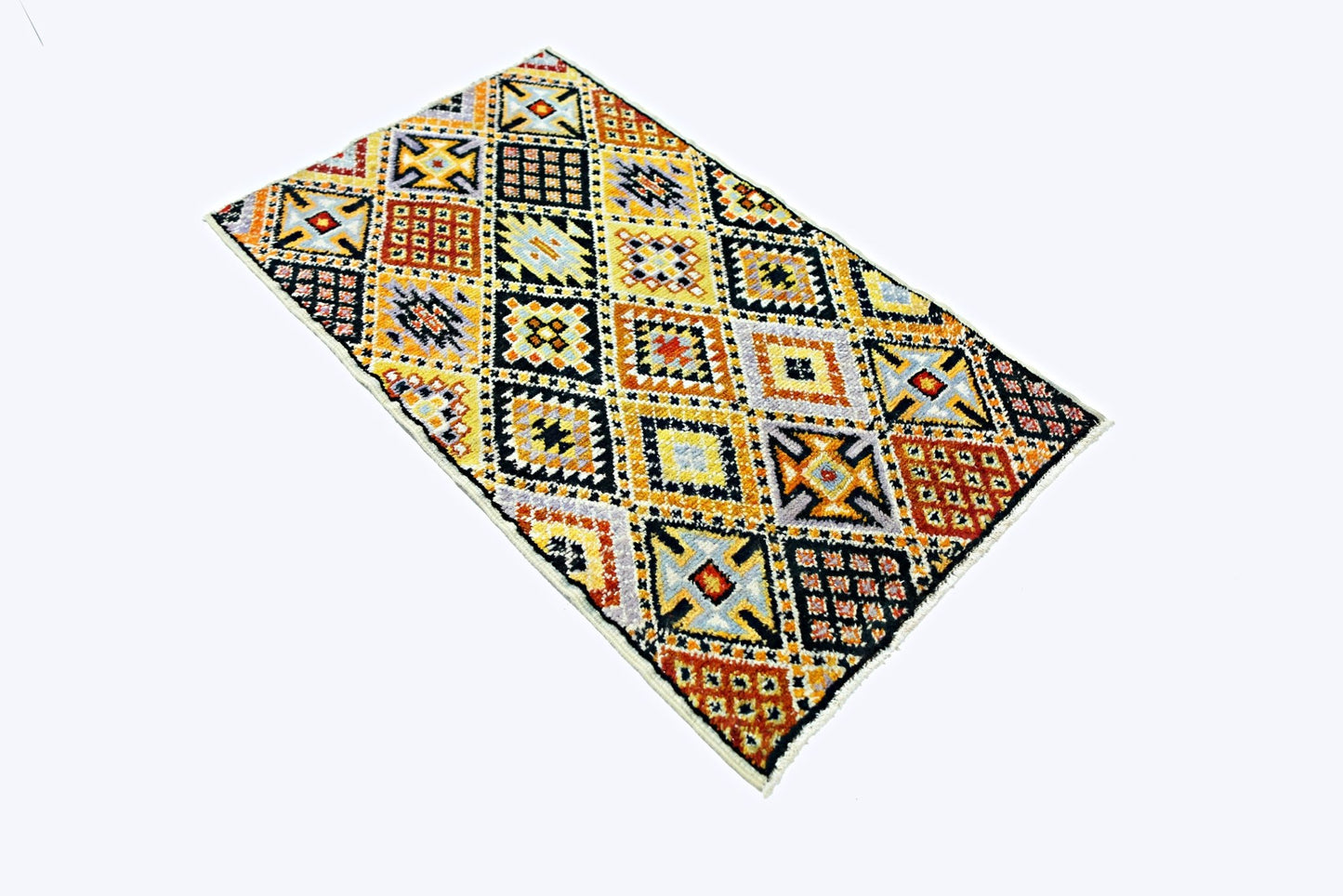 A rectangular Afghan hand-knotted wool rug featuring a vibrant geometric diamond pattern.