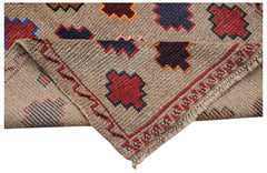 A handmade Afghan Pashm rug featuring geometric tribal patterns in red, blue, and brown tones.