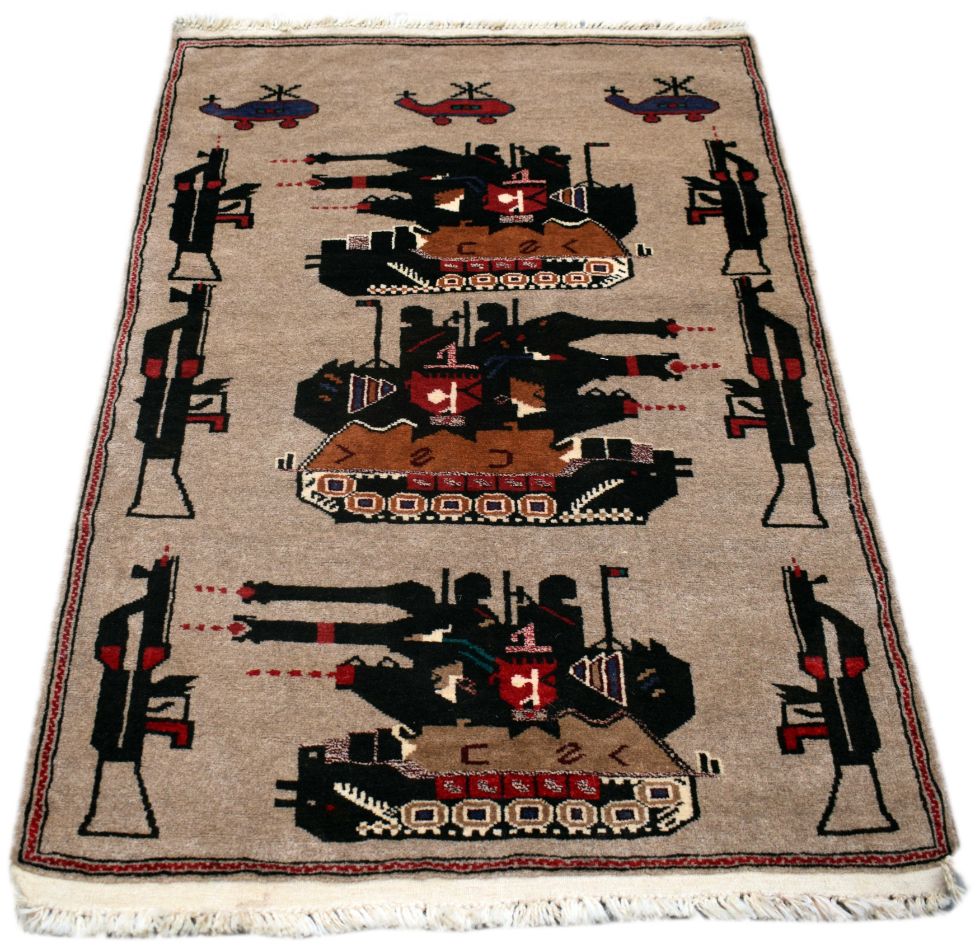 A handmade Afghan wool rug featuring a pattern of tanks, helicopters, and rifles.