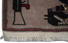 A handmade Afghan Pashm rug featuring geometric war-themed motifs on a tan wool background.