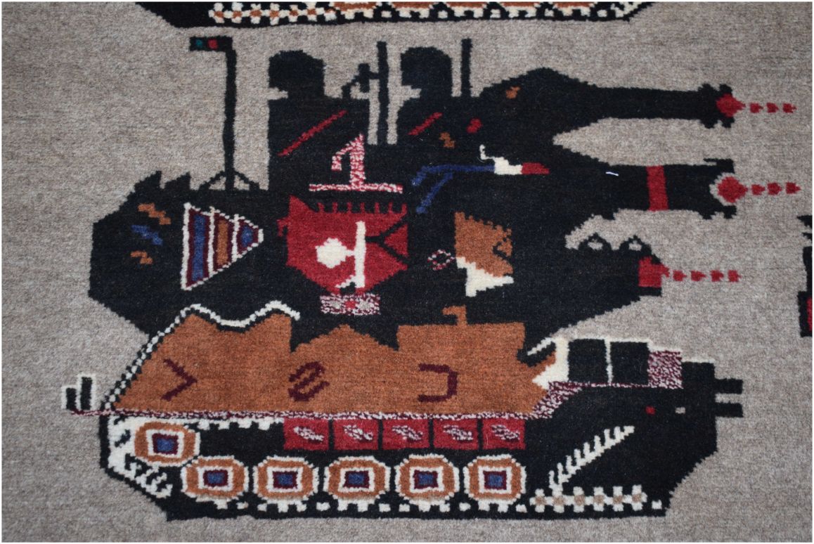 Handmade Afghan wool rug featuring a stylized black tank with red and blue geometric details.