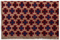 Handmade Afghan Pashm rug featuring a repeating geometric cross pattern in red, blue, and brown.