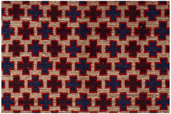 Handmade Afghan Pashm rug featuring a repeating geometric cross pattern in blue, red, and brown.