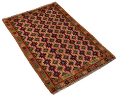 A handmade Afghan Pashm rug featuring a geometric pattern in shades of red, brown, and blue.