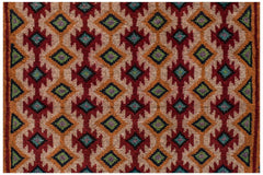 Handmade Afghan Pashm rug featuring a repeating geometric diamond pattern in red, orange, and blue.