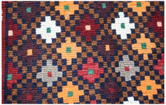 Handmade Afghan Pashm rug featuring a geometric pattern in dark red, blue, brown, and ivory wool.