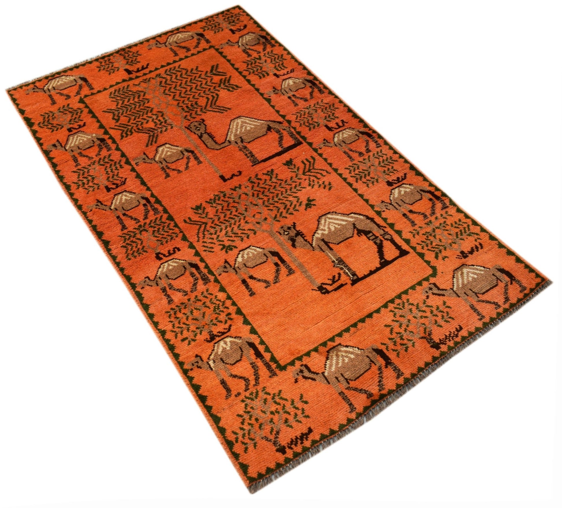 An orange hand-knotted Afghan wool rug featuring a repeating pattern of camels and trees.