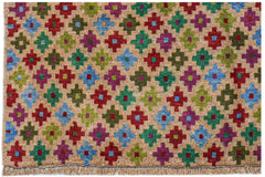 Handmade Afghan Pashm rug featuring a repeating pattern of colorful geometric motifs on a tan base.