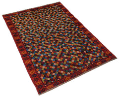 Handmade Afghan Pashm rug featuring a colorful geometric diamond pattern on a dark red background.