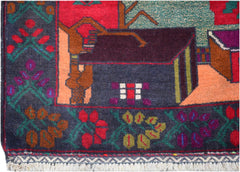 A handmade Afghan wool rug featuring a dark blue border with floral motifs and a central house scene.