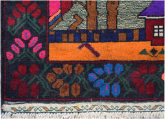 A handmade Afghan wool rug featuring a dark border with floral patterns and a vibrant orange field.