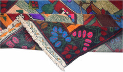 A handmade Afghan wool rug featuring a colorful tribal pattern with floral and geometric motifs.