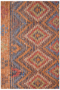 Handmade Afghan Pashm rug featuring a tribal pattern in shades of orange, blue, and red.