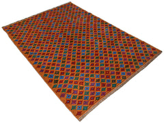 Handmade Afghan Pashm rug featuring a repeating geometric floral pattern in blue, red, and green.