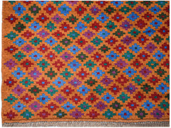 Handmade Afghan Pashm rug featuring a repeating geometric pattern in blue, red, green, and purple.