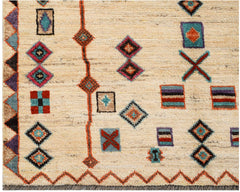 Hand-knotted Afghan wool rug featuring a cream field with colorful geometric tribal motifs.