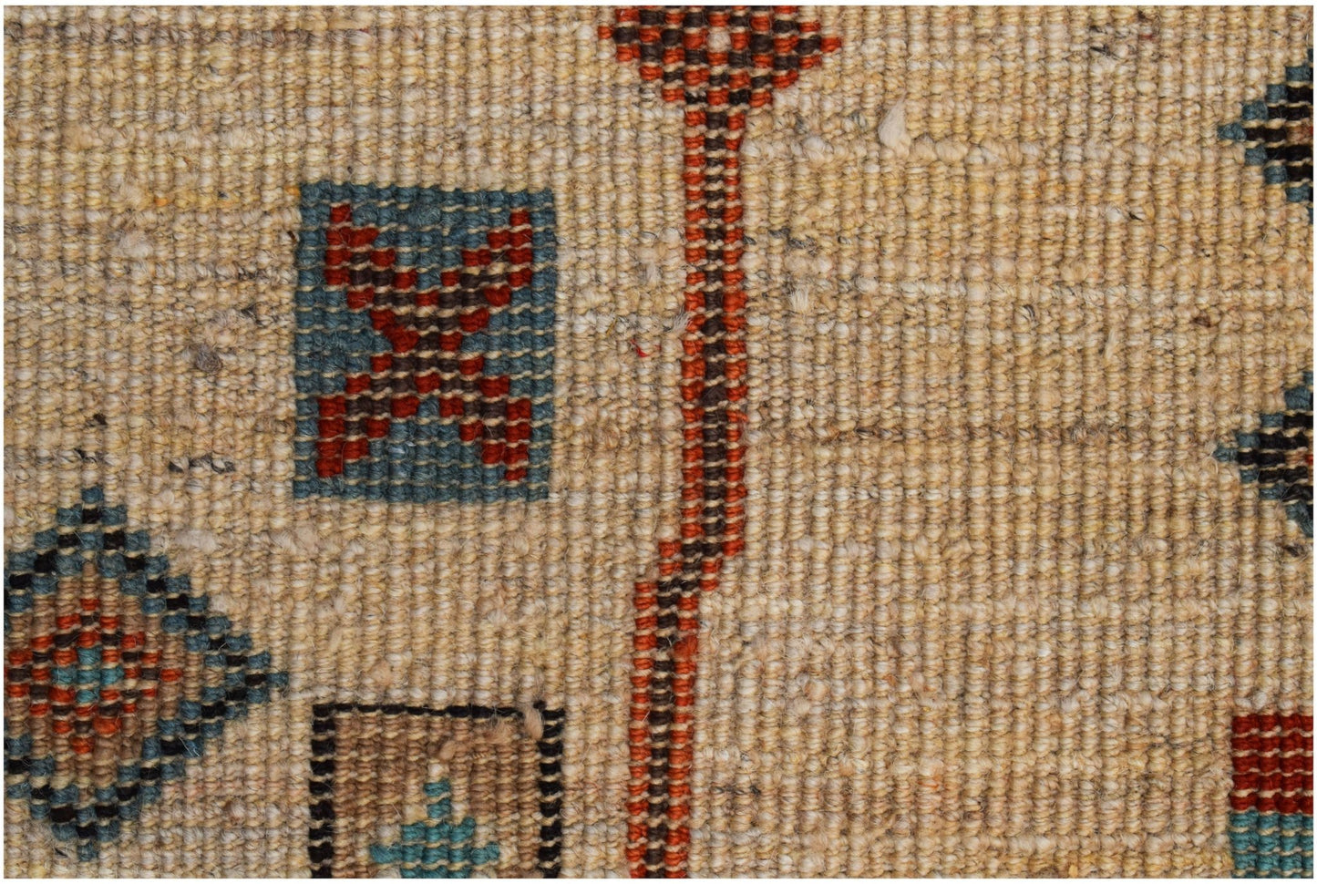A hand-knotted Afghan wool rug featuring geometric patterns in blue, red, and tan tones.