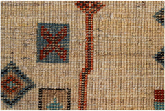 A hand-knotted Afghan wool rug featuring geometric patterns in blue, red, and tan tones.