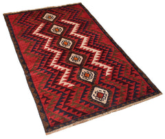 Handmade Afghan Pashm rug featuring a geometric tribal pattern in red, brown, and ivory wool.