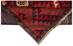 A handmade Afghan Pashm rug featuring a geometric tribal pattern in deep red, brown, and blue.