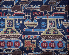 Handmade Afghan wool rug featuring a dark blue field with repeating tank and military motifs.