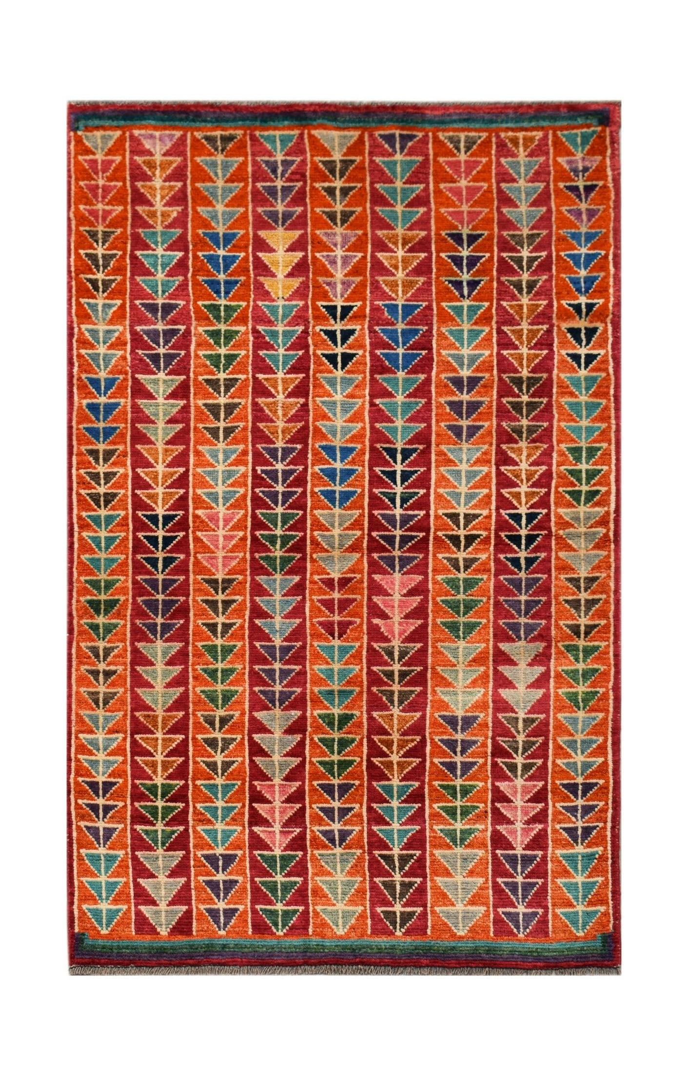 Hand-knotted Afghan wool rug featuring a vibrant geometric pattern of colorful stacked triangles.