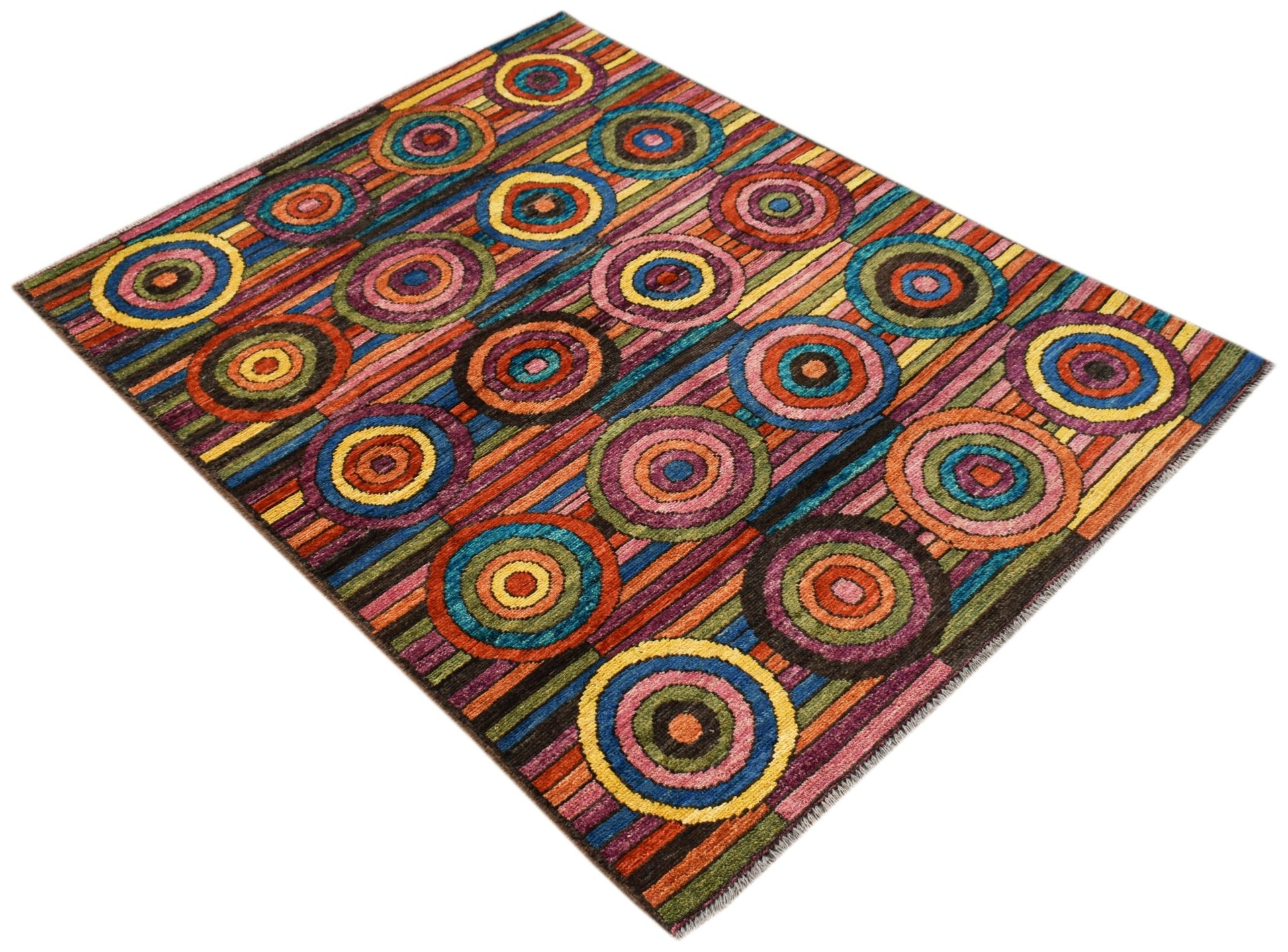 A hand-knotted Afghan wool rug featuring a vibrant, multicolored pattern of concentric circles.
