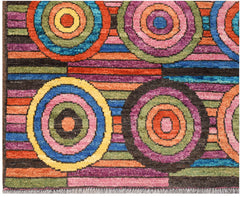 Hand-knotted Afghan wool rug featuring a vibrant geometric pattern of colorful concentric circles.